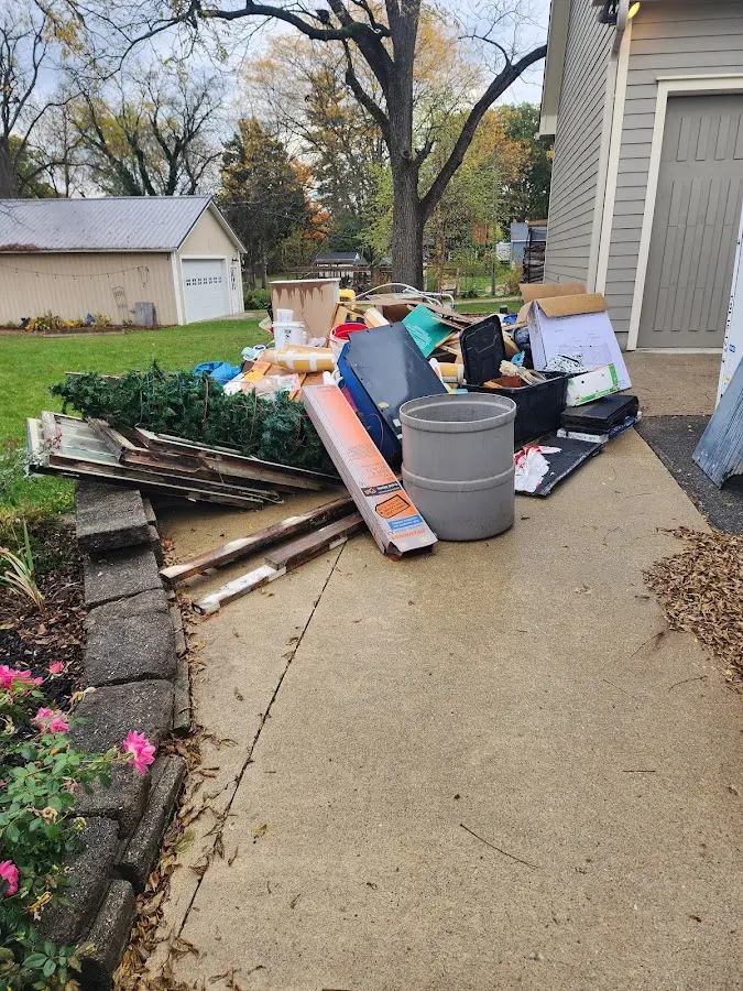 Dumpster being loaded with debris for Estate Cleanout Dumpster Rental in El Dorado Hills